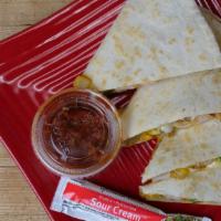 Chicken Quesadillas · Flour tortilla, chicken, onion, peppers, cheddar and pepper jack cheese.