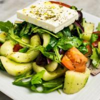 Taverna Style Greek Salad (Large) · Tomatoes, onion, cucumber, barrel aged feta.