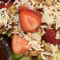 Strawberry Festival Salad · Spring All the Time, A bed of mixed crisp Iceberg & Romaine with tomatoes, walnuts,. red roa...