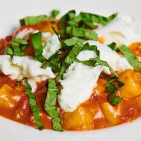 Gnocchi Al Pomodoro · Homemade potato gnocchi, fresh tomato sauce, basil and mozzarella cheese.