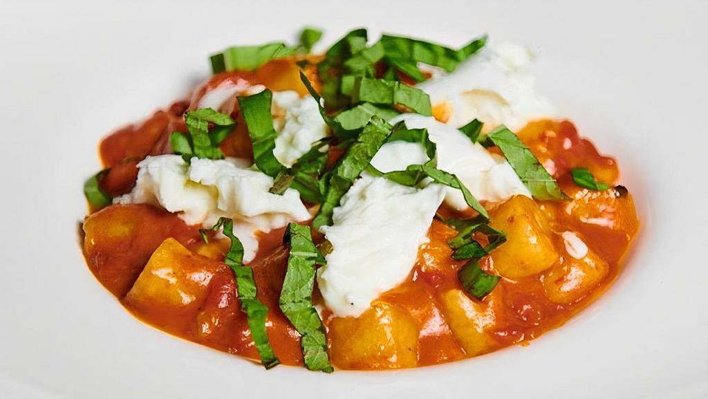 Gnocchi Al Pomodoro · Homemade potato gnocchi, fresh tomato sauce, basil and mozzarella cheese.