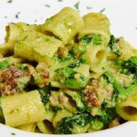 Rigatoni Con Salsiccia E Broccoli Rabe · Rigatoni pasta with spicy Italian sausage and broccoli rabe.
