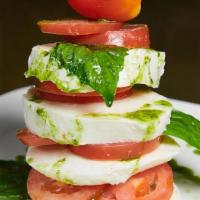 Caprese Salad · Mozzarella cheese, tomato, fresh basil and EVOO.