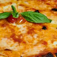 Vegan Margaritaa Pizza · Vegan Mozzarella Cheese, tomato sauce and basil.