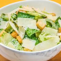 Caesar Salad · Romaine lettuce, anchovies, caesar dressing, croutons, shaved parmesan, runny egg.