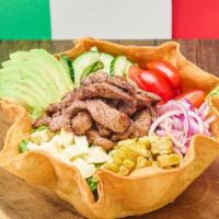 Taco Bowl · Flour tortilla, lettuce, tomato, onion, cheese, shredded meat, sour cream, salsa, avocado.