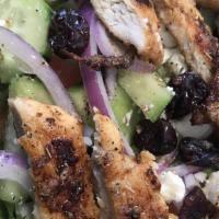 House Salad · Greens, cucumbers, grilled chicken feta cranberries, walnuts, and tomato's.
