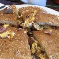 Pancakes Quesadilla · Eggs, Bacon, Sausage, Ham and Cheddar Cheese.