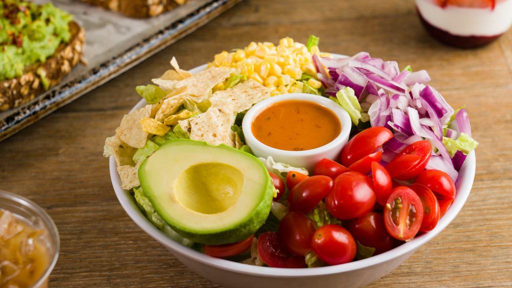 Santa Fe · Half Avocado, Roasted Corn, Cheddar Cheese, Tomatoes, Red Onions, Tortilla Chips & Crisp Romaine.

We Recommend Our Chipotle Vinaigrette Dressing.