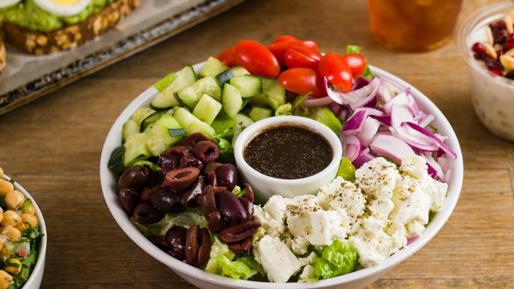 Greek Salad · Feta Cheese, Kalamata Olives, Tomatoes, Bell Peppers, Red Onions, Cucumbers & Crisp Romaine.

We Recommend Extra Virgin Olive Oil & Red Wine Vinegar