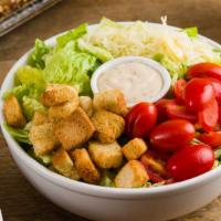 Classic Caesar · Tomatoes, Croutons, Shaved Parmesan with Crisp Romaine.

We Recommend Our Homemade Caesar Dr...