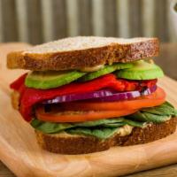 Avocado Veggie (Vegan) · Tomatoes, Red Onions, Baby Spinach, Sliced Avocado, Roasted Peppers, Hummus on Whole Wheat T...