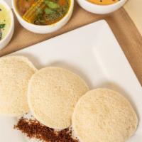 Idly · Steamed rice cakes served with sambar, coconut chutney and idly kaaram.