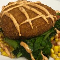 Lump Crab Cake · Crab cake over sautéed spinach, corn and tomato topped with Cajun remoulade.
