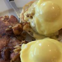 Crab Benedict · Two poached eggs with crab cakes on an English muffin, topped with hollandaise sauce.