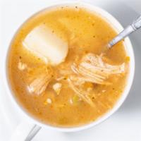 Sopa De Pollo · Chicken soup mixed with rice and vegetables.