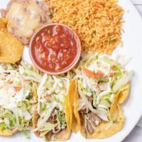 Tostada · Three open crispy tortillas, topped with beans, shredded beef, lettuce, cheese, pico de gall...
