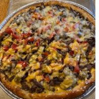 Philly Cheese Steak Pizza · Fresh rolled pizza dough topped with sliced steak, sautéed mushrooms, onions and cheese.
