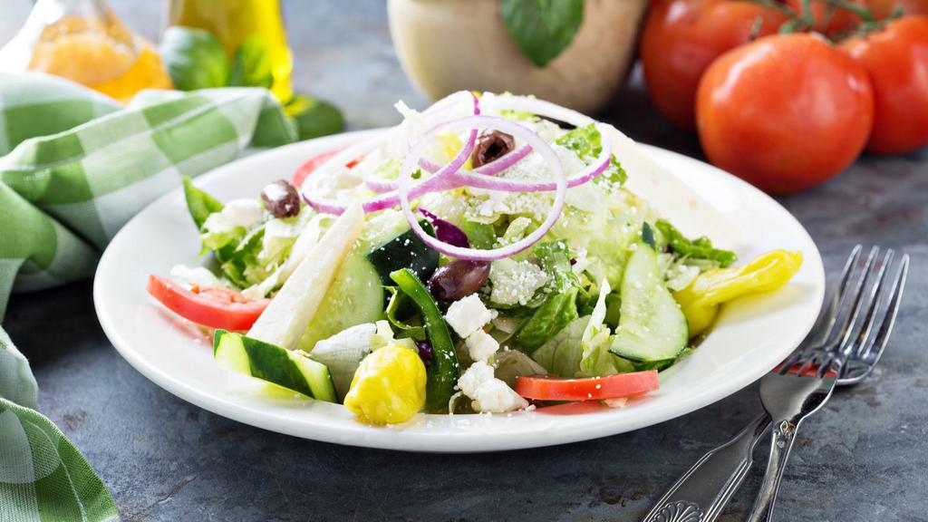 House Salad · A fresh medley of tomato, cucumber, roasted peppers, black & green olives, and shredded mozzarella cheese over a bed of iceberg and romaine lettuce, served with house Italian dressing or substitute a dressing of your choice.