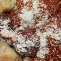Pasta And Meatballs · Pasta served with 3 of our homemade meatballs and served with 2 garlic knots.