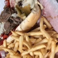 Philly Cheesesteak · Steak, peppers, onions, and mushrooms with mozzarella cheese. Served with fries.