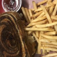 Rueben · Corned beef, sauerkraut, and Swiss with thousand island on rye. Served with fries.