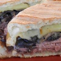 Roast Beef Panini · Roast Beef  with Cheddar cheese, Mushrooms and a Horsey Mayo served with a side of Fries