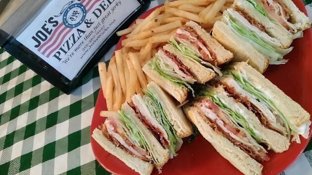 Club Sandwich · Triple decker with lettuce, tomato, bacon, cheese, and mayo. Served with fries.
