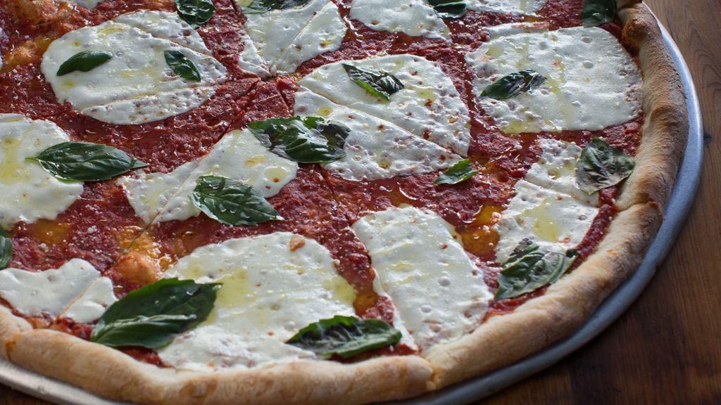 Margherita Pizza · Fresh mozz, tomato, parm, basil, and EVOO.
