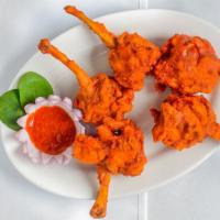 Chicken Lollipop · Marinated chicken wings deep fried, sauteed with spices, and herbs.