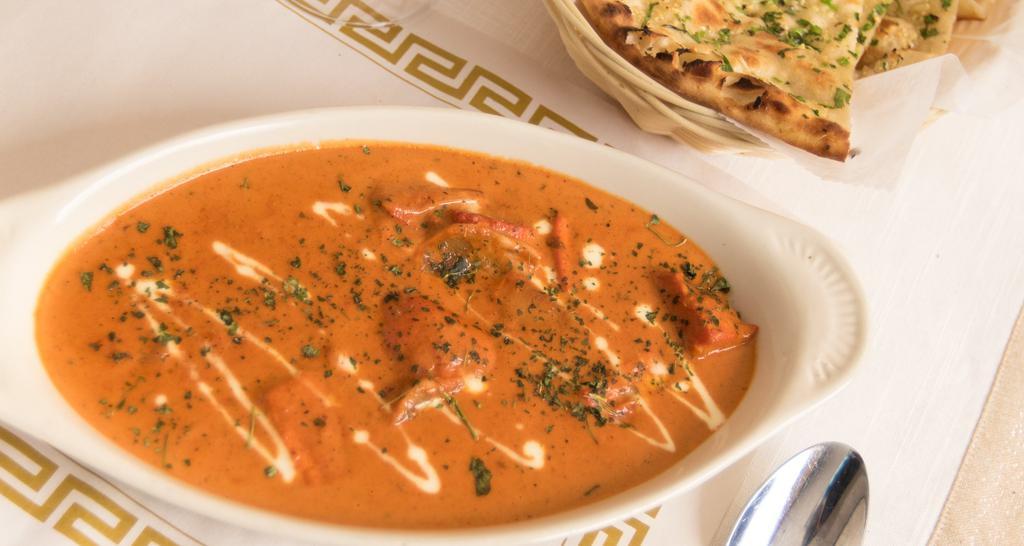 Chicken Tikka Masala · Chunks Of Chicken Grilled In A Clay Oven And Then Cooked In A Light Creamy Tomato Sauce With Bell Peppers And Onions.