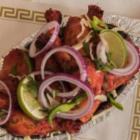 Kodi Tandoori (Chicken Tandoori - Full) · Chicken leg and thigh pieces are marinated overnight in yogurt with herbs and spices and coo...