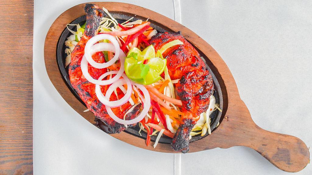 Kodi Tandoori (Chicken Tandoori - Full) · Chicken Legs And Thigh Pieces Are Marinated Overnight In Yogurt With Herbs And Spices And Cooked On Skewers In Tandoor (Clay Oven).