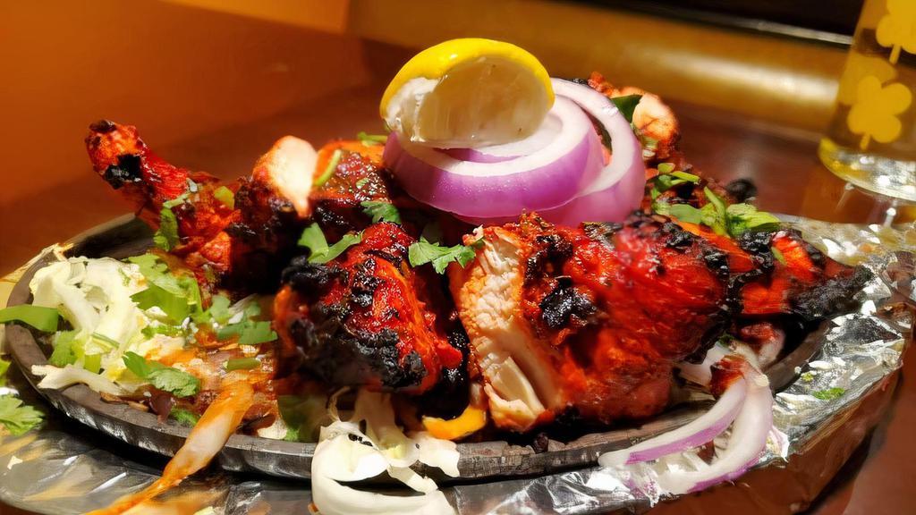 Chicken Tikka · Boneless Free Range Chicken Pieces Marinated In Yogurt, Mace, Ginger And Other Spices Grilled In A Tandoor(Clay Oven).