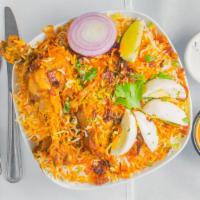 Hyderabadi Chicken Dum Biryani · Basmati Rice Cooked With Chicken On Dum Over Slow Heat Marinated With Fresh Herbs, Spices, A...