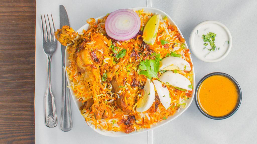 Hyderabadi Chicken Dum Biryani · Basmati Rice Cooked With Chicken On Dum Over Slow Heat Marinated With Fresh Herbs, Spices, And Home-Made Biryani Masala.