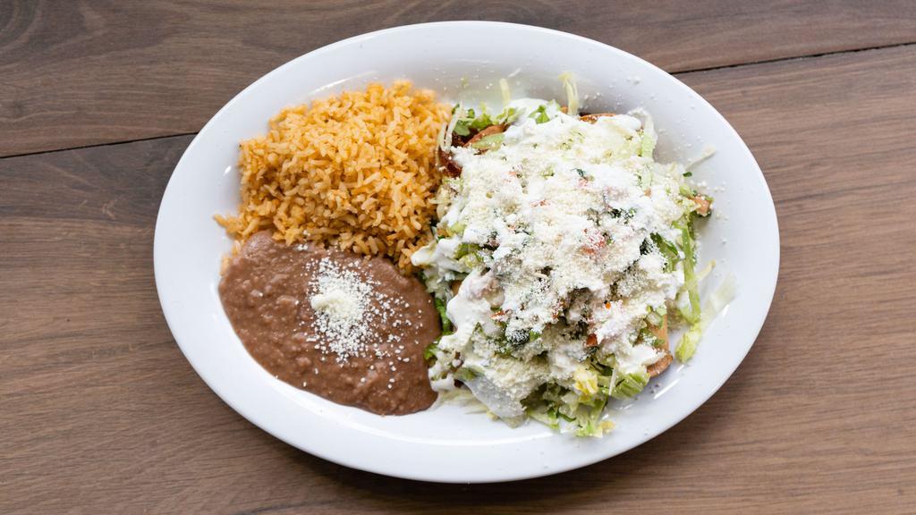 Flautas · 3 Fried corn tortilla stuffed with chicken and cheese served with lettuce, pico de gallo, cheese, and cream and green salsa. Served with rice and beans.