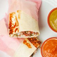 *Chicken Tinga Burrito · The most savory burrito, filled with slow-cooked dark meat pulled chicken, served with cilan...