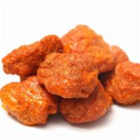 Spicy Chicken Nuggets · Golden crispy chicken nuggets tossed in our spicy hot sauce.