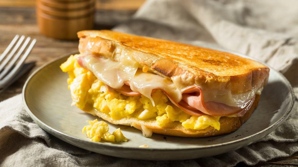 Turkey, Ham, Egg & Cheese Breakfast Sandwich · Delicious Breakfast sandwich containing cooked eggs, turkey, ham, and melted cheese. Served on customer's choice of bread.
