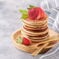 Buttermilk Pancakes With Strawberries · 3 pieces of freshly prepared Pancakes. Topped with fresh strawberry slices.