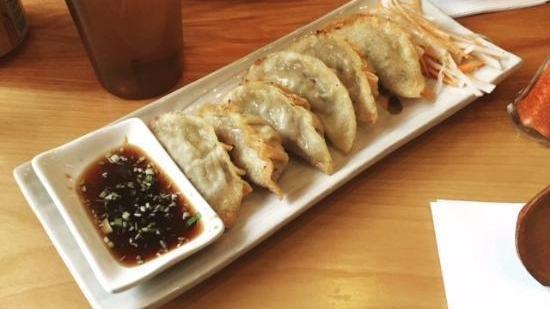Jikasei Pork Gyoza · Pan fried dumplings filled with ground pork, cabbage and chives.