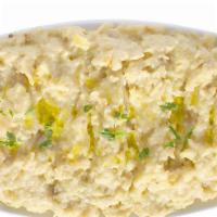 Baba Ghanoush · Char-grilled smoked eggplant purée flavored with tahini, garlic, olive oil and lemon juice.
