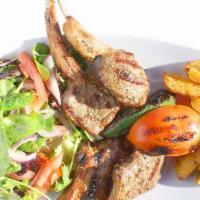 Lamb Chops · Lamb chops char-grilled, served with mixed greens and a side dish.