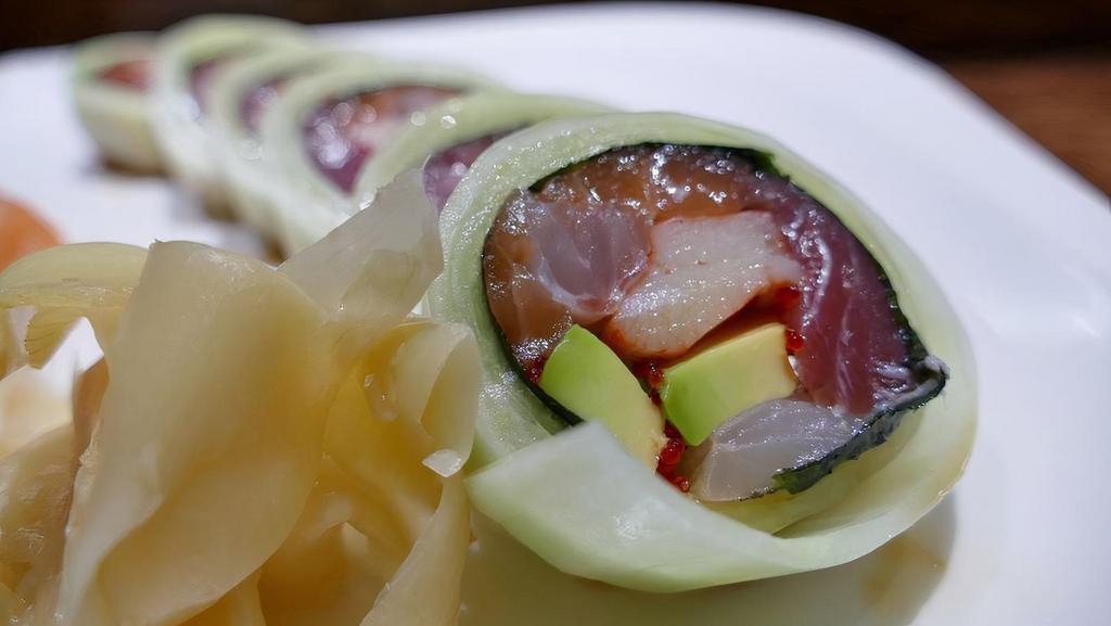 Rainbow Naruto · Five pieces of raw fish, avocado & tobiko, wrapped with thin-sliced cucumber, glazed with chef's special sauce.