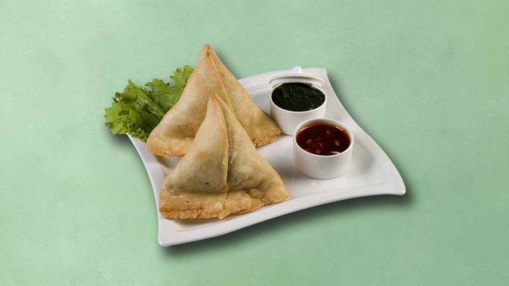 Village Veg Samosa · Filo pastry filled with gently spiced potato mash, peas, and dry spice mix deep-fried till golden and crisp