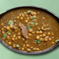 Garbanzo Beans & Spinach · Chickpeas and puréed spinach cooked in juicy onions, tomatoes, and perfectly grounded spices