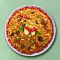 Village Veg Biryani · Long grain aromatic basmati rice simmered in aromatic Indian spices and layered with seasona...