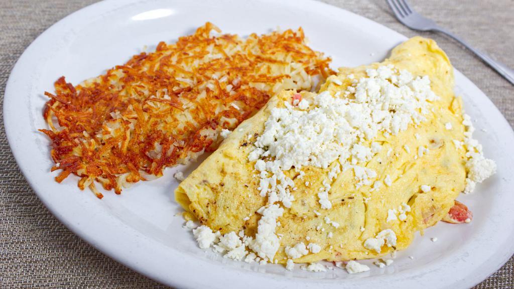 Greek Omelette · With onion, tomato and feta cheese. Served with home fries and buttered toast.