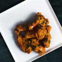 Chicken Wings · Served with Ranch or Blue Cheese sauce..